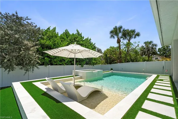 a view of a backyard with a patio