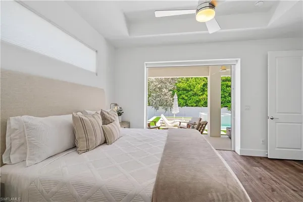 a living room with furniture a window and a flat screen tv