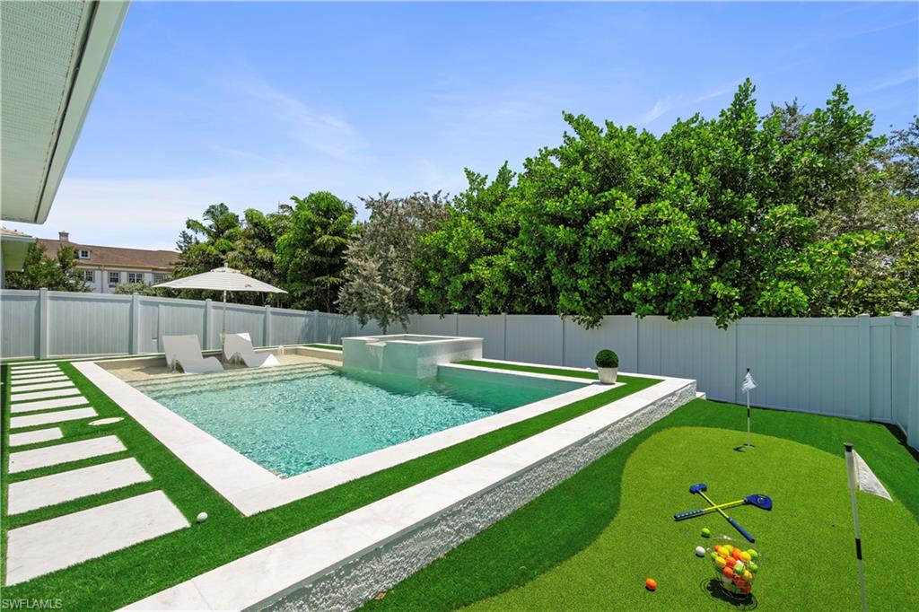 1100 Steeves Avenue Naples, FL 34104 - Photo 7 of 38 a view of a backyard with trampoline