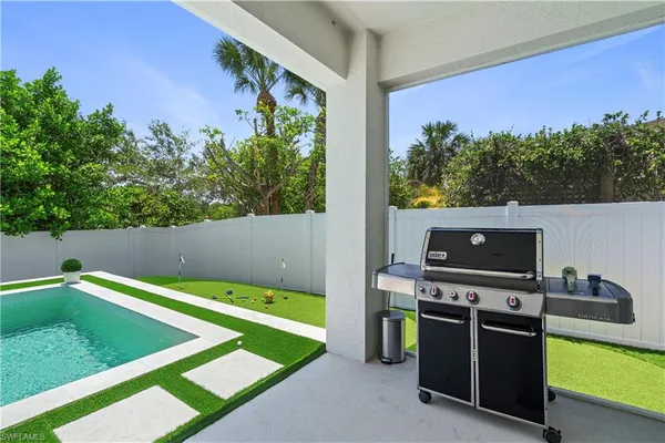 a view of a television with chairs in the room
