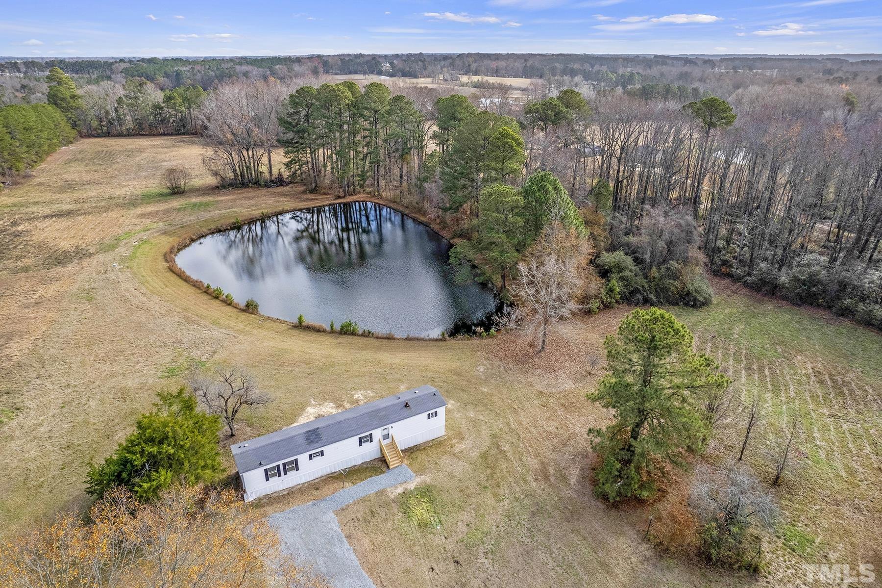 4920 Zacks Mill Road Angier, NC 27501 - Photo 25 of 30 an aerial view of a house with outdoor space