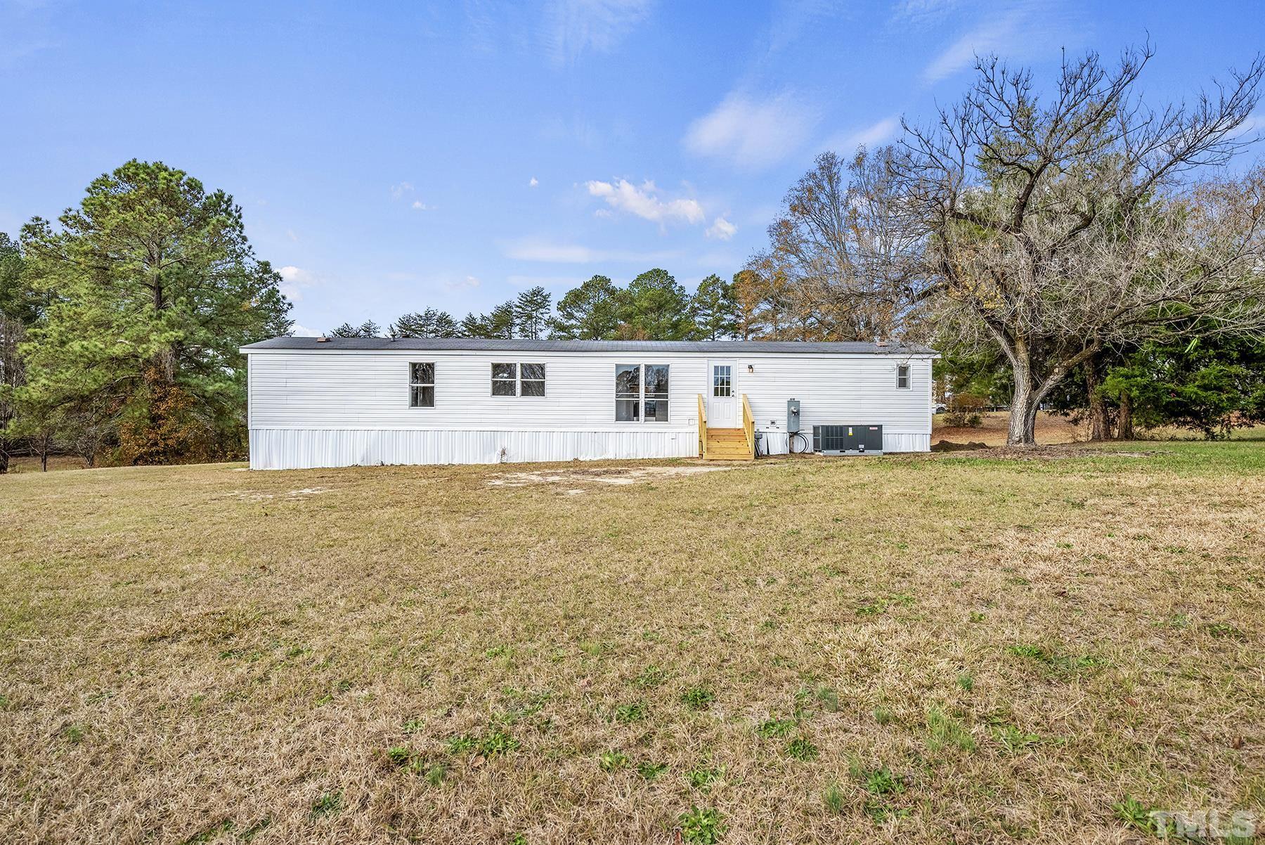 4920 Zacks Mill Road Angier, NC 27501 - Photo 30 of 30 a front view of house with yard and trees around