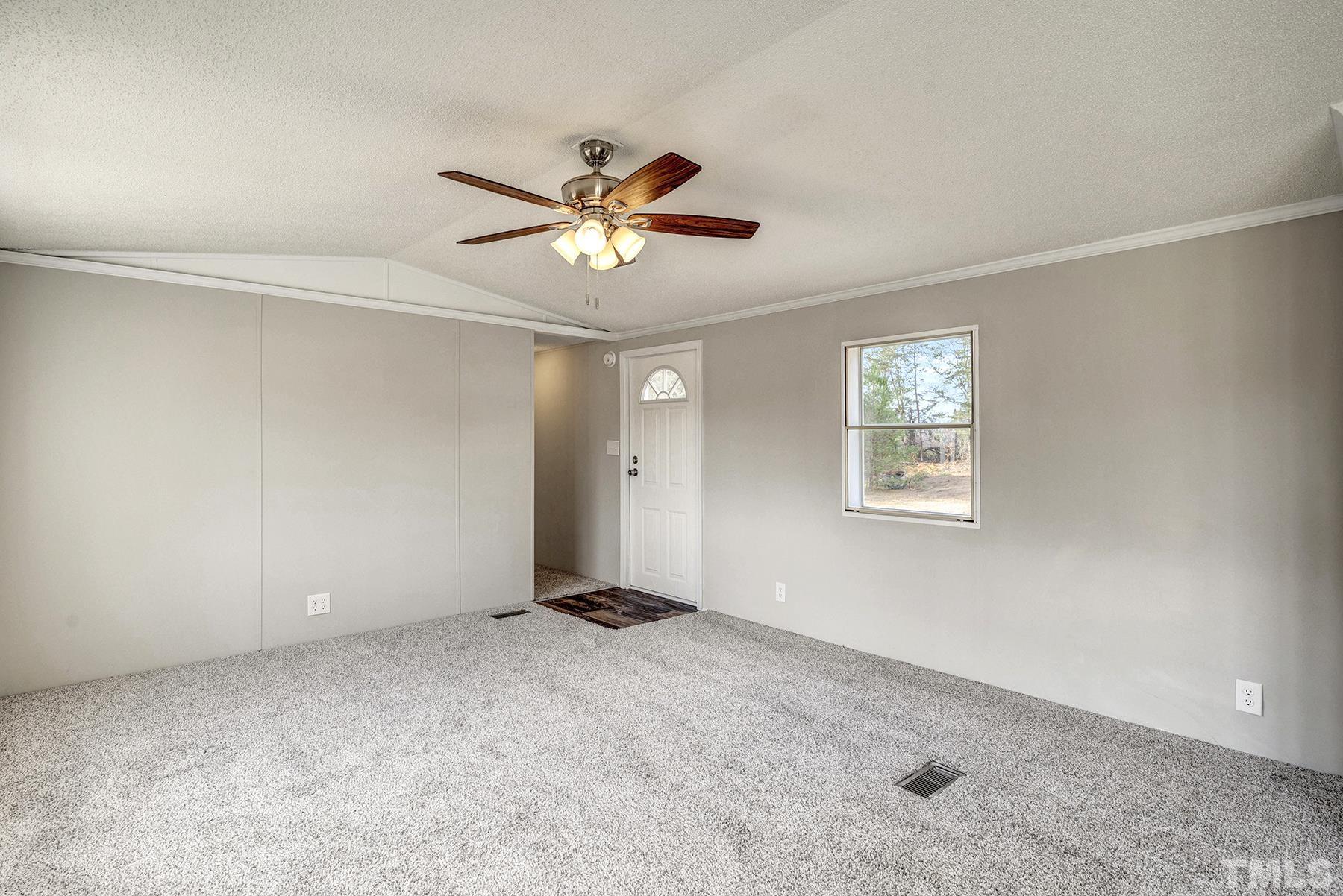 4920 Zacks Mill Road Angier, NC 27501 - Photo 6 of 30 a view of an empty room with a window