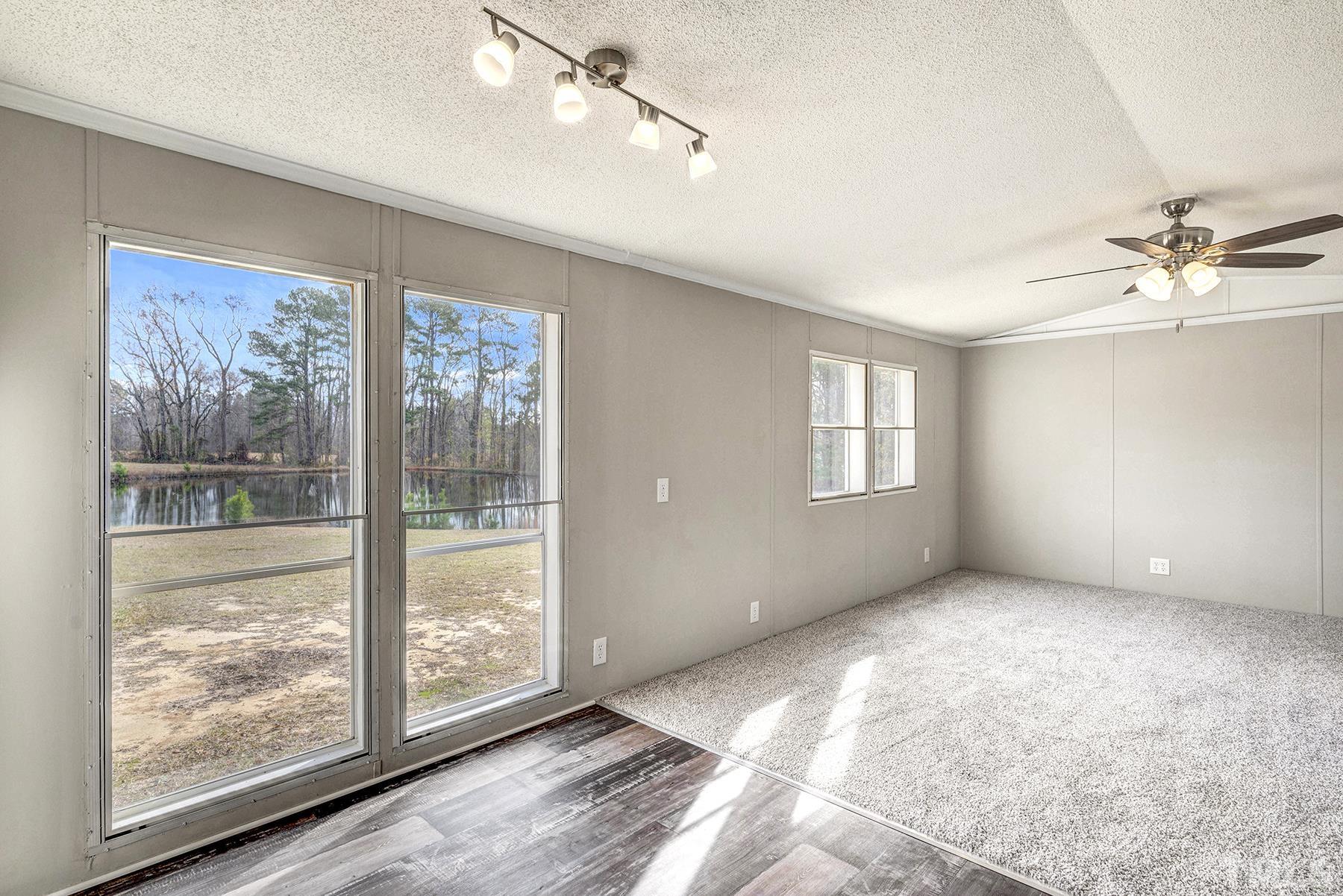 4920 Zacks Mill Road Angier, NC 27501 - Photo 10 of 30 a view of an empty room with a window