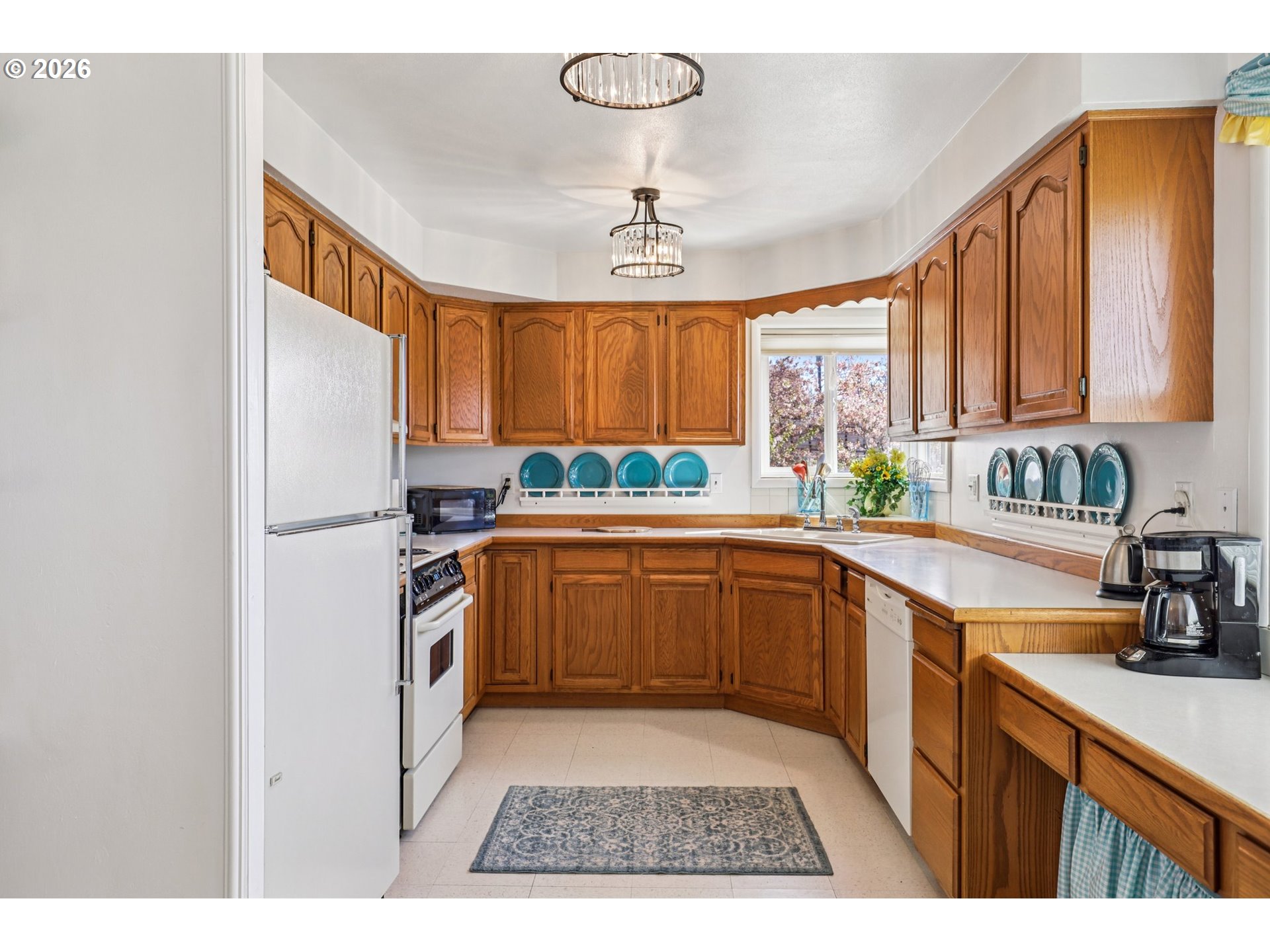 801 Cowlitz Way Kelso, WA 98626 - Photo 11 of 36 a kitchen with a refrigerator sink and cabinets