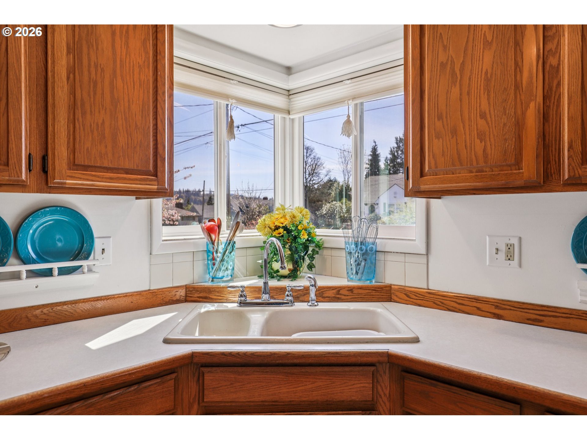 801 Cowlitz Way Kelso, WA 98626 - Photo 16 of 36 a kitchen with kitchen island a sink cabinets and a window