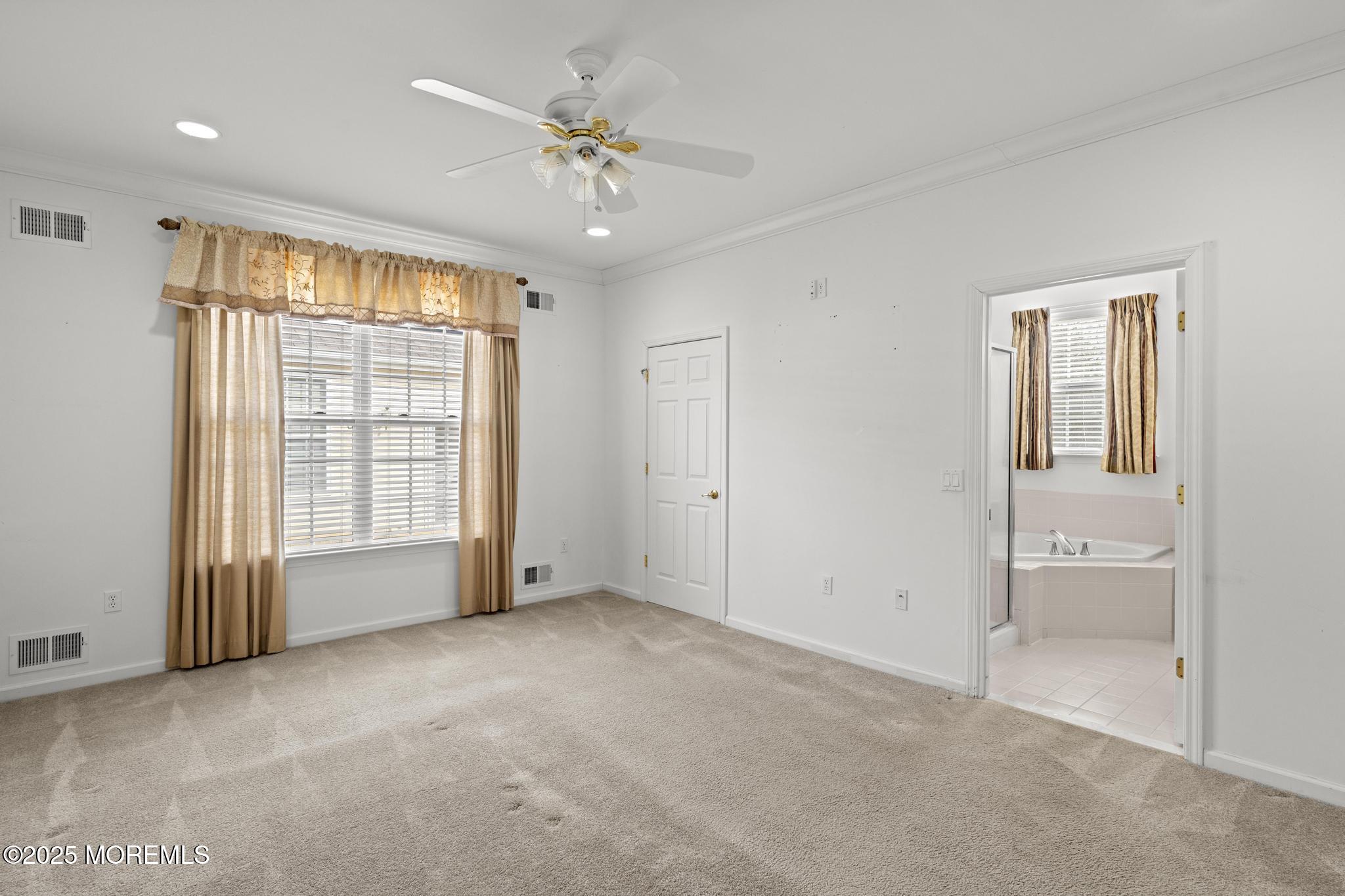 24 Battle Road Manchester Township, NJ 08759 - Photo 20 of 30 an empty room with chandelier fan and windows