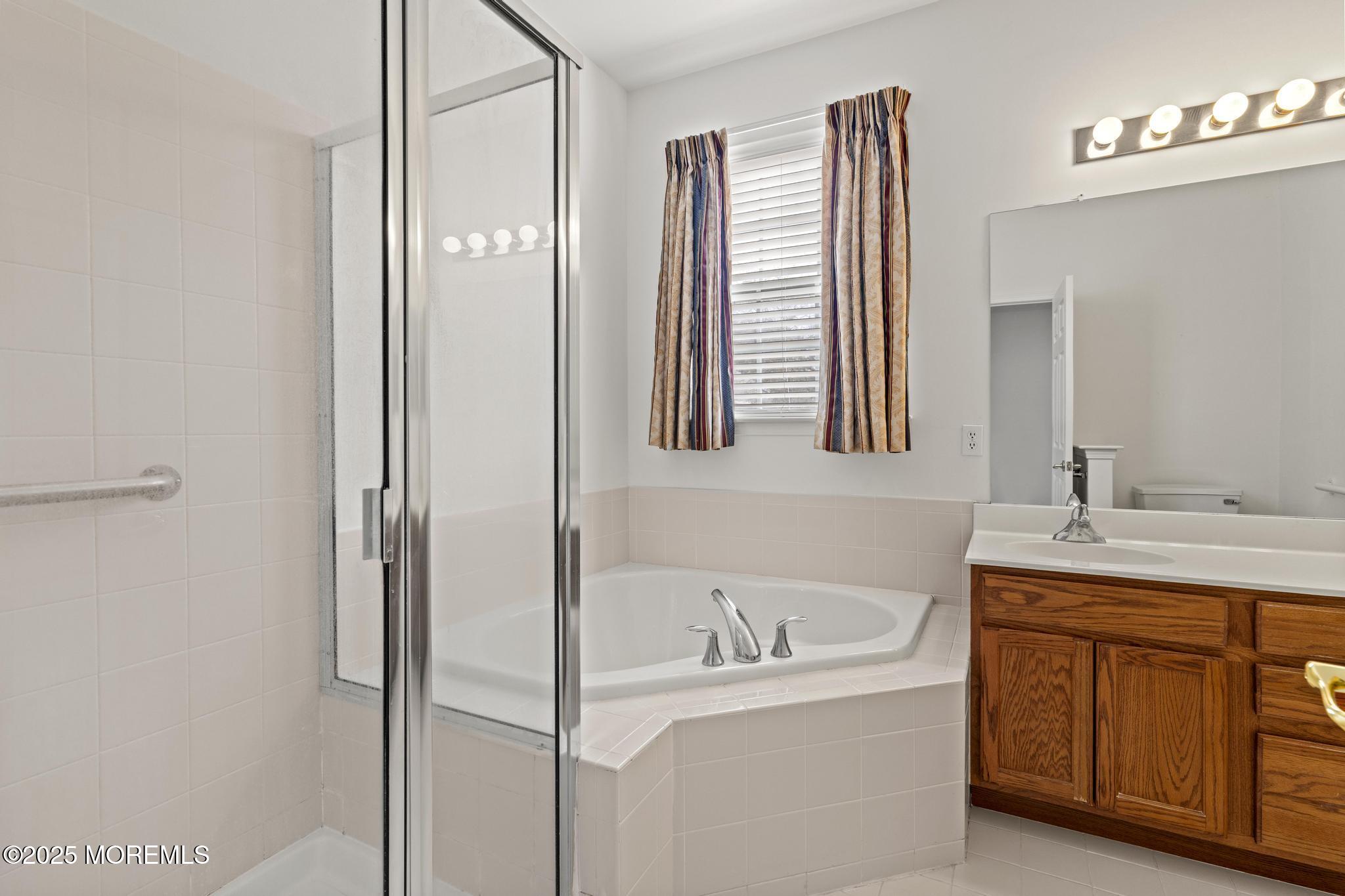 24 Battle Road Manchester Township, NJ 08759 - Photo 21 of 30 a bathroom with a bathtub and a sink