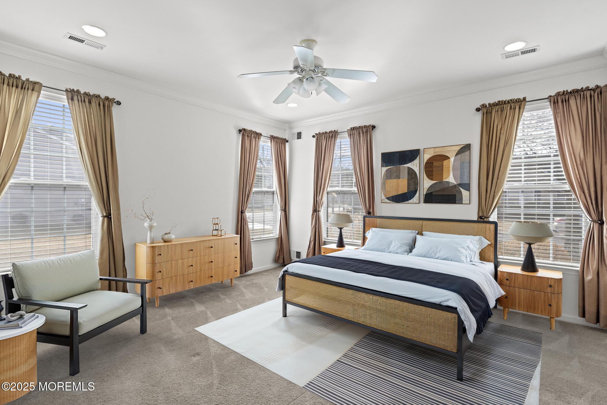 24 Battle Road Manchester Township, NJ 08759 - Photo 24 of 30 a spacious bedroom with a bed a couch and large window