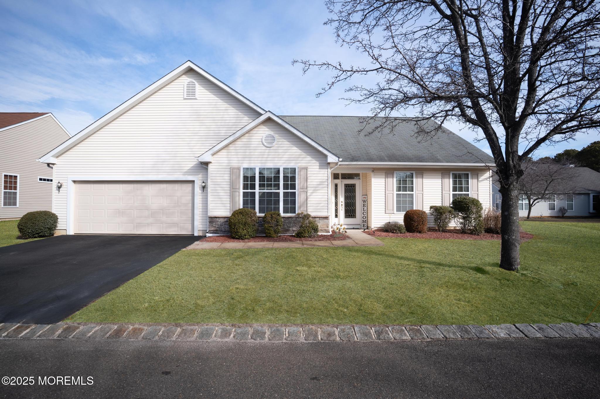 24 Battle Road Manchester Township, NJ 08759 - Photo 3 of 30 a view of a yard in front of a house with large windows