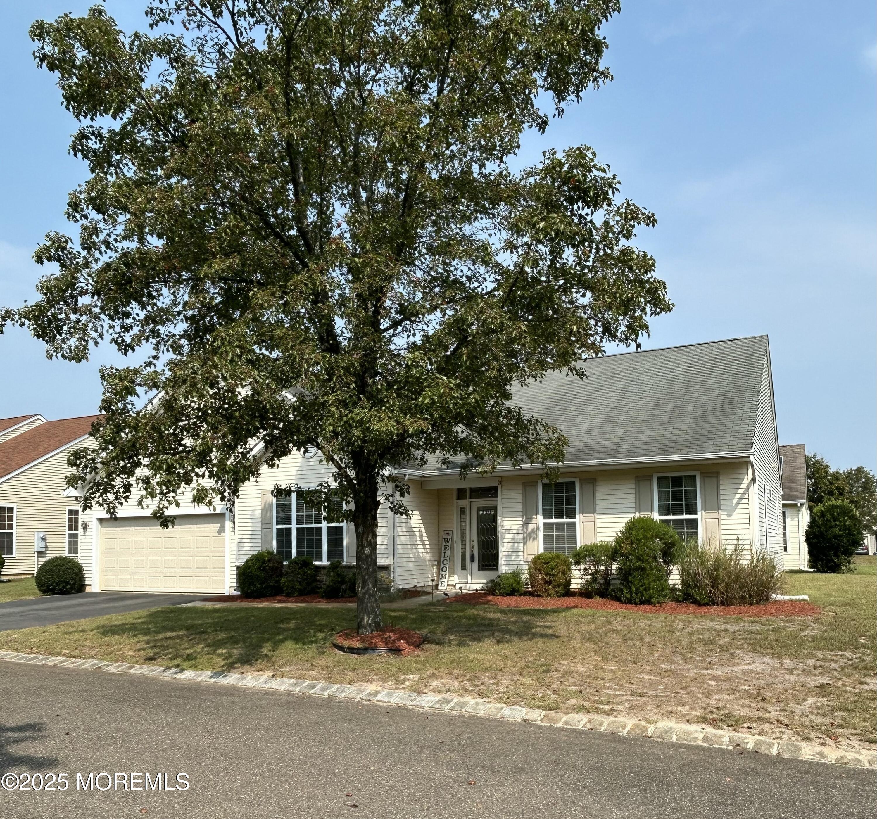 24 Battle Road Manchester Township, NJ 08759 - Photo 5 of 30 a view of a house with a tree in front of it