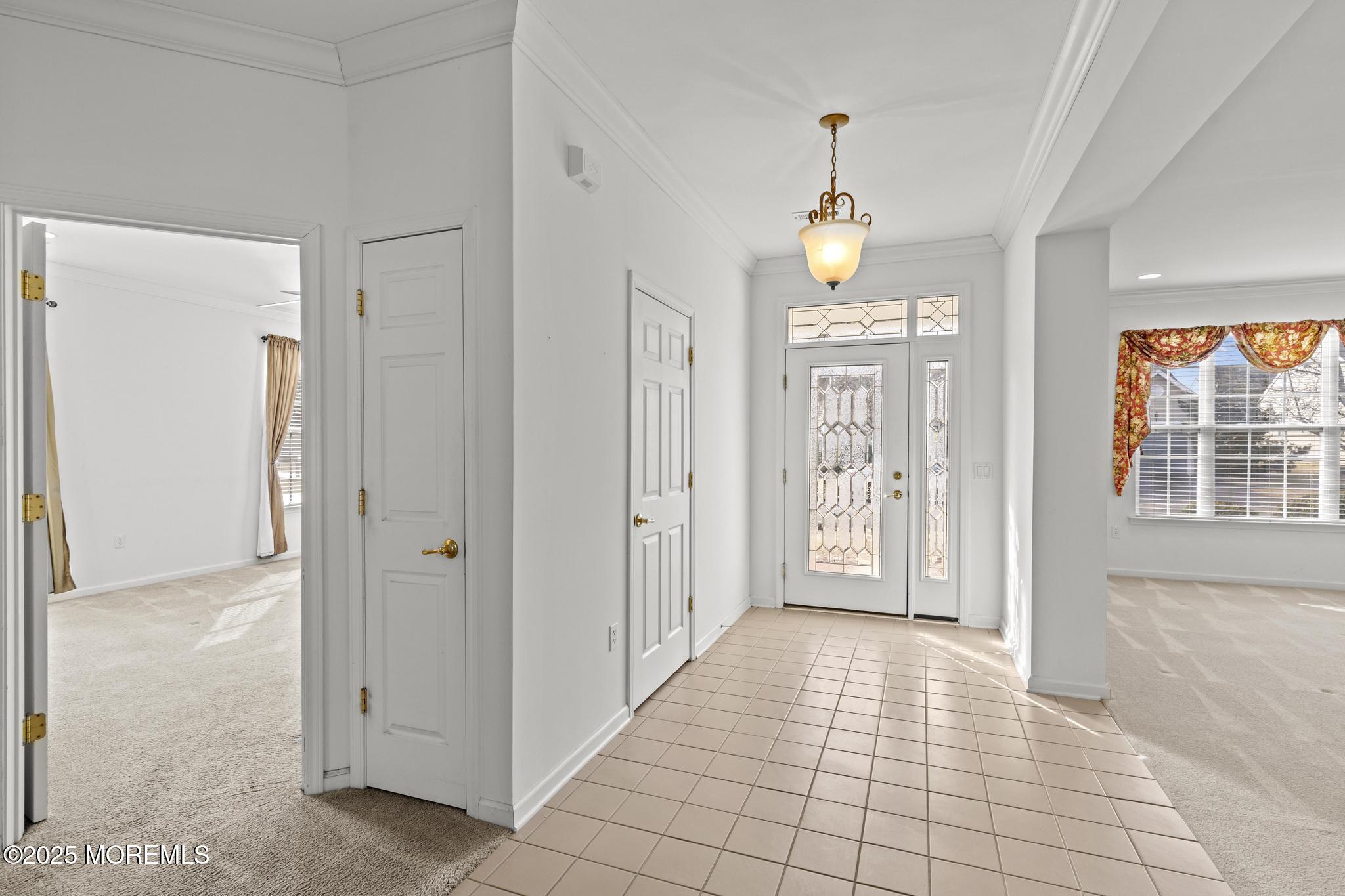 24 Battle Road Manchester Township, NJ 08759 - Photo 7 of 30 a view of a hallway to a bedroom with windows