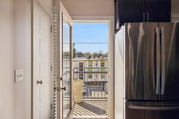 a view of a refrigerator and a window