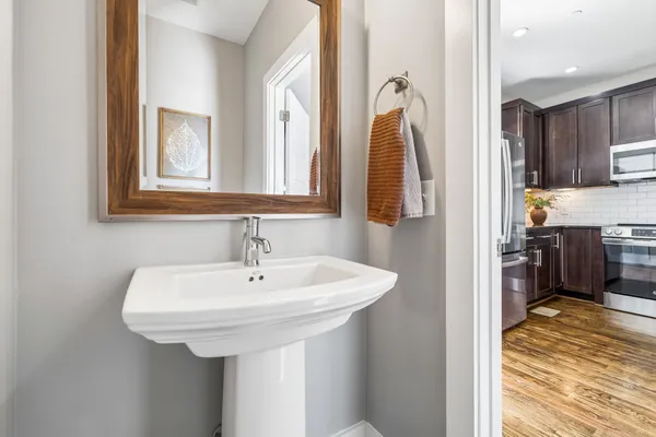 a bathroom with a sink and a mirror