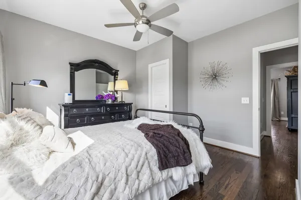 a bedroom with a bed and a mirror