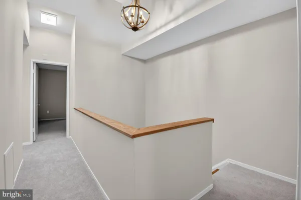 a view of a hallway with seating area