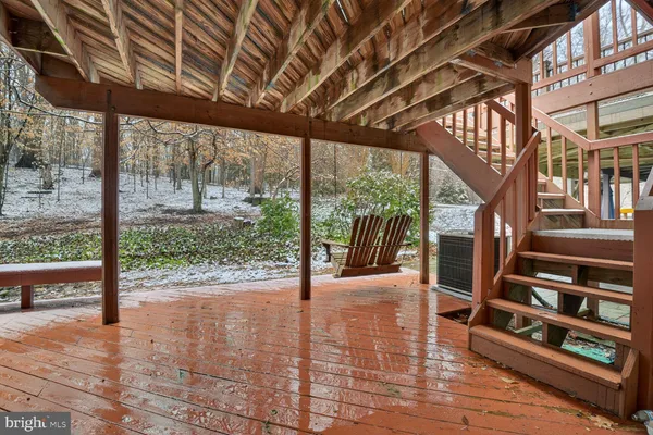 a view of staircase with wooden floor and fence