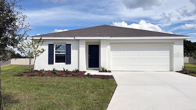 13267 Southwest 56th Terrace Ocala, FL 34473 - Photo 1 of 1 a front view of a house with a yard