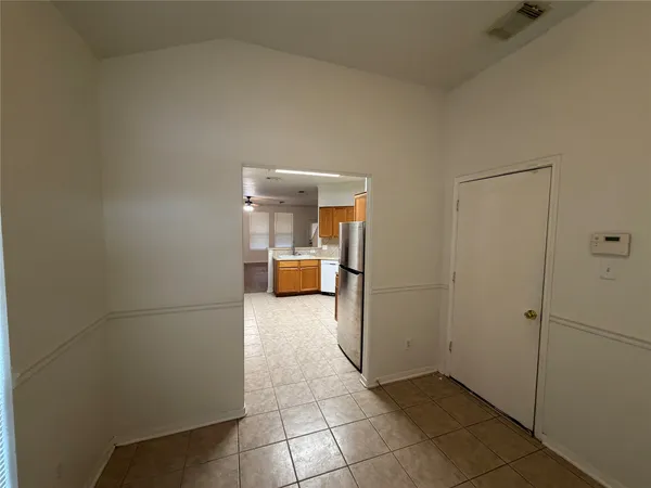 a view of a storage & utility room with a sink