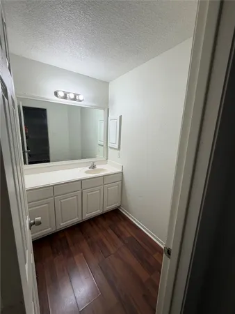 a bathroom with a double vanity sink and mirror