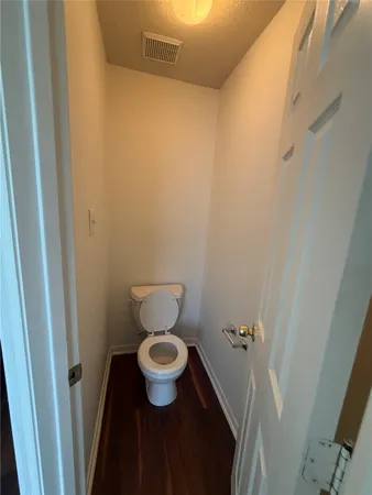 a toilet room with a sink and a toilet