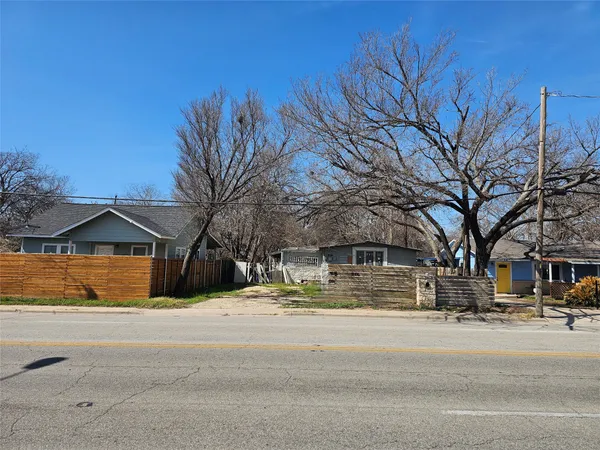 a view of road with a house