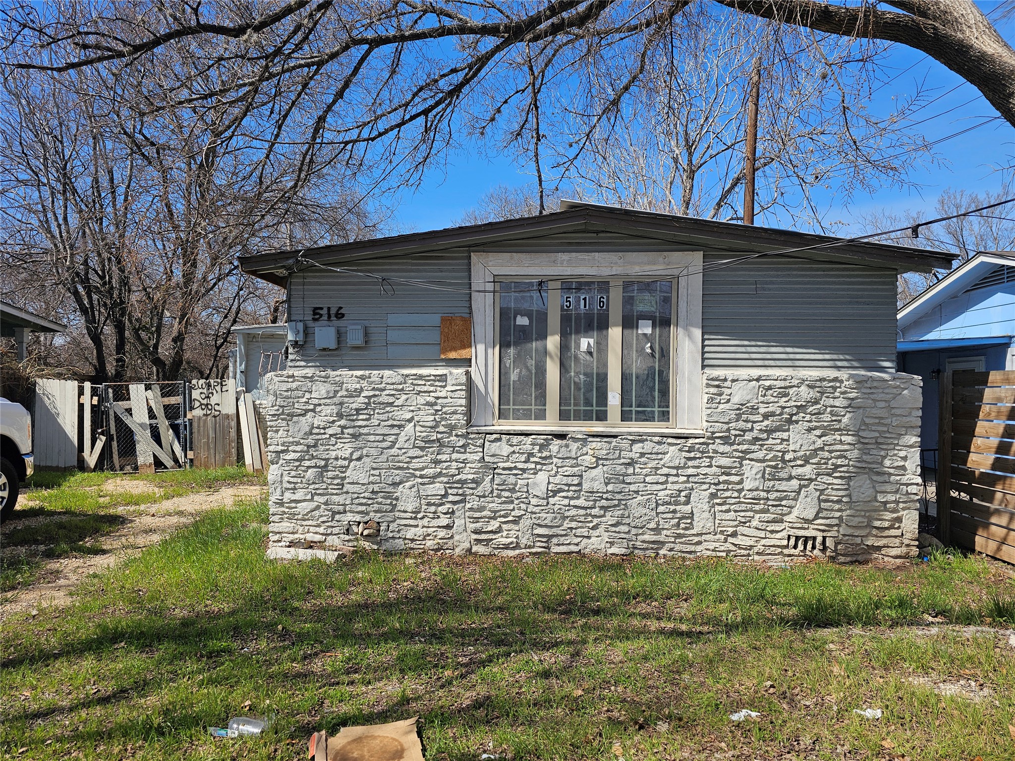 516 Montopolis Drive Austin, TX 78741 - Photo 2 of 3 a front view of a house with garden
