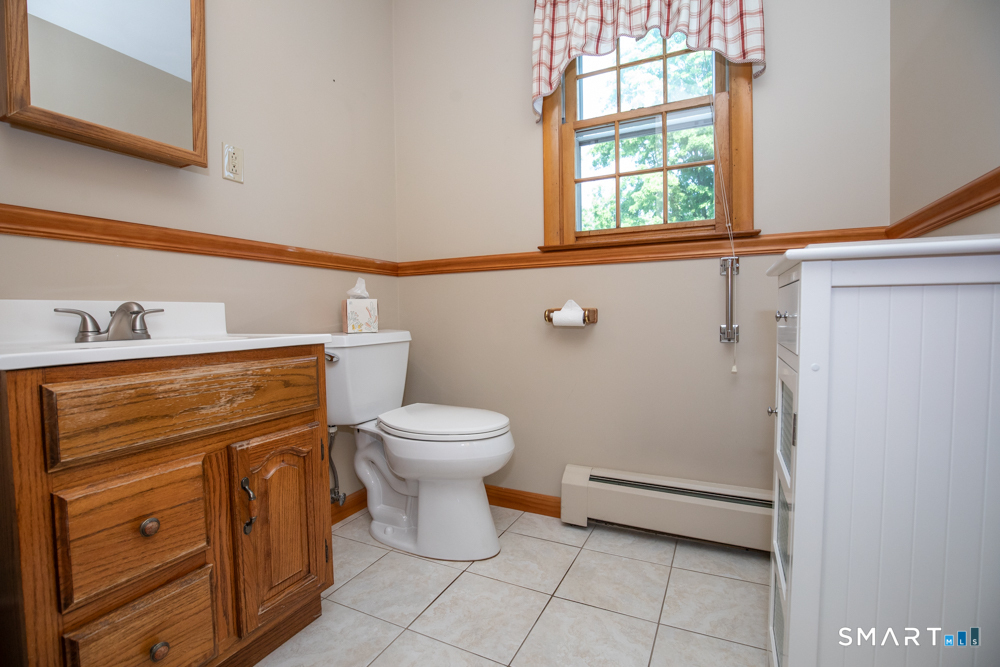 153 Fiesta Heights Meriden, CT 06451 - Photo 18 of 32 Half bathroom on first floor
