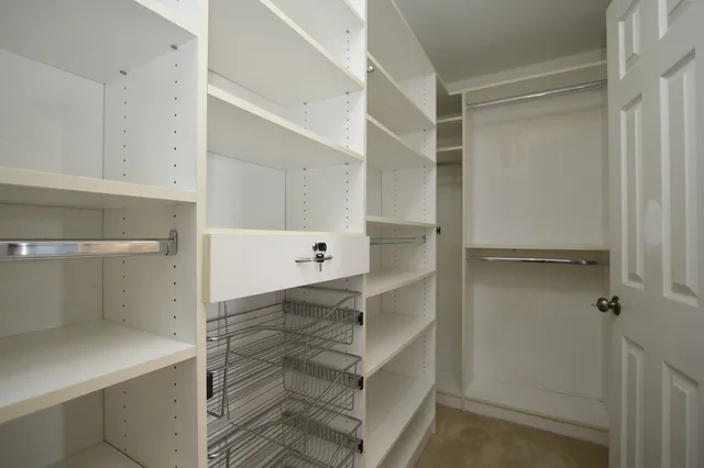 a view of an empty walk in closet