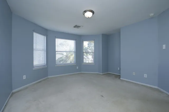 an empty room with windows