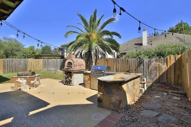 a view of a dinning table and chairs in patio