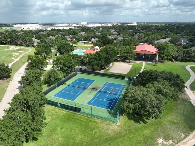 an aerial view of a houses with outdoor space and street view