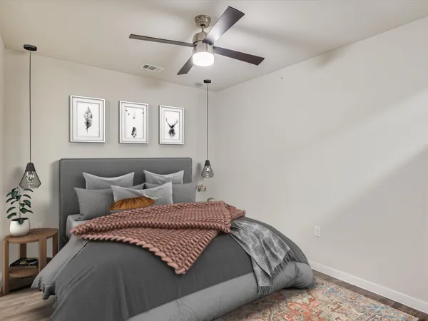 a bedroom with a bed and window
