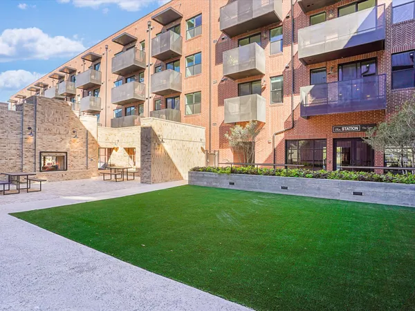 a view of a building with a yard