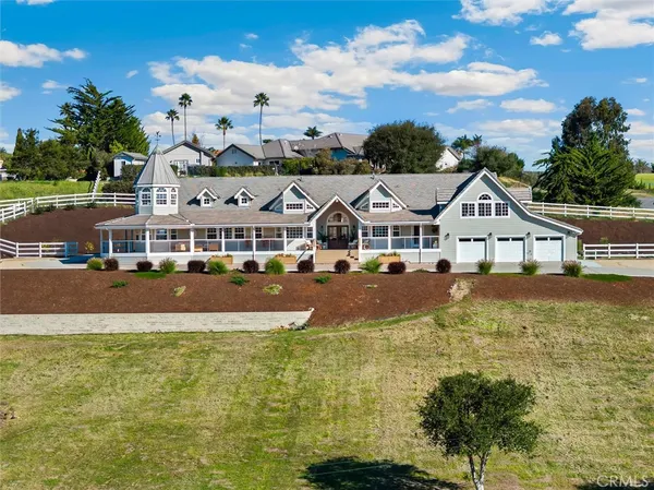 a aerial view of residential houses with yard and swimming pool