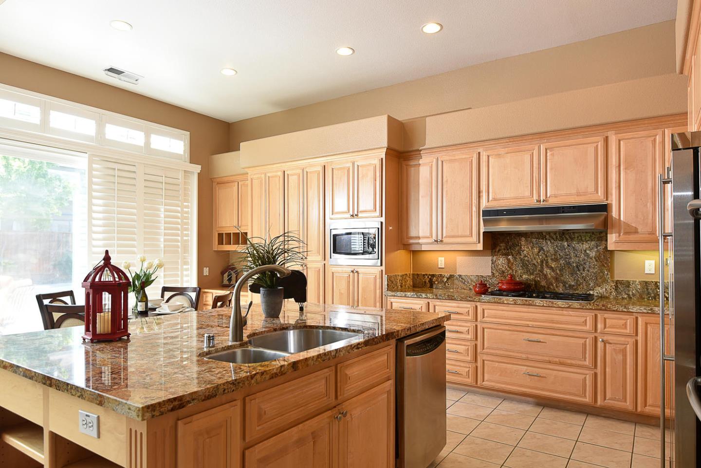 1492 Red Tail Place Morgan Hill, CA 95037 - Photo 12 of 25 a kitchen with counter top space cabinets and stainless steel appliances
