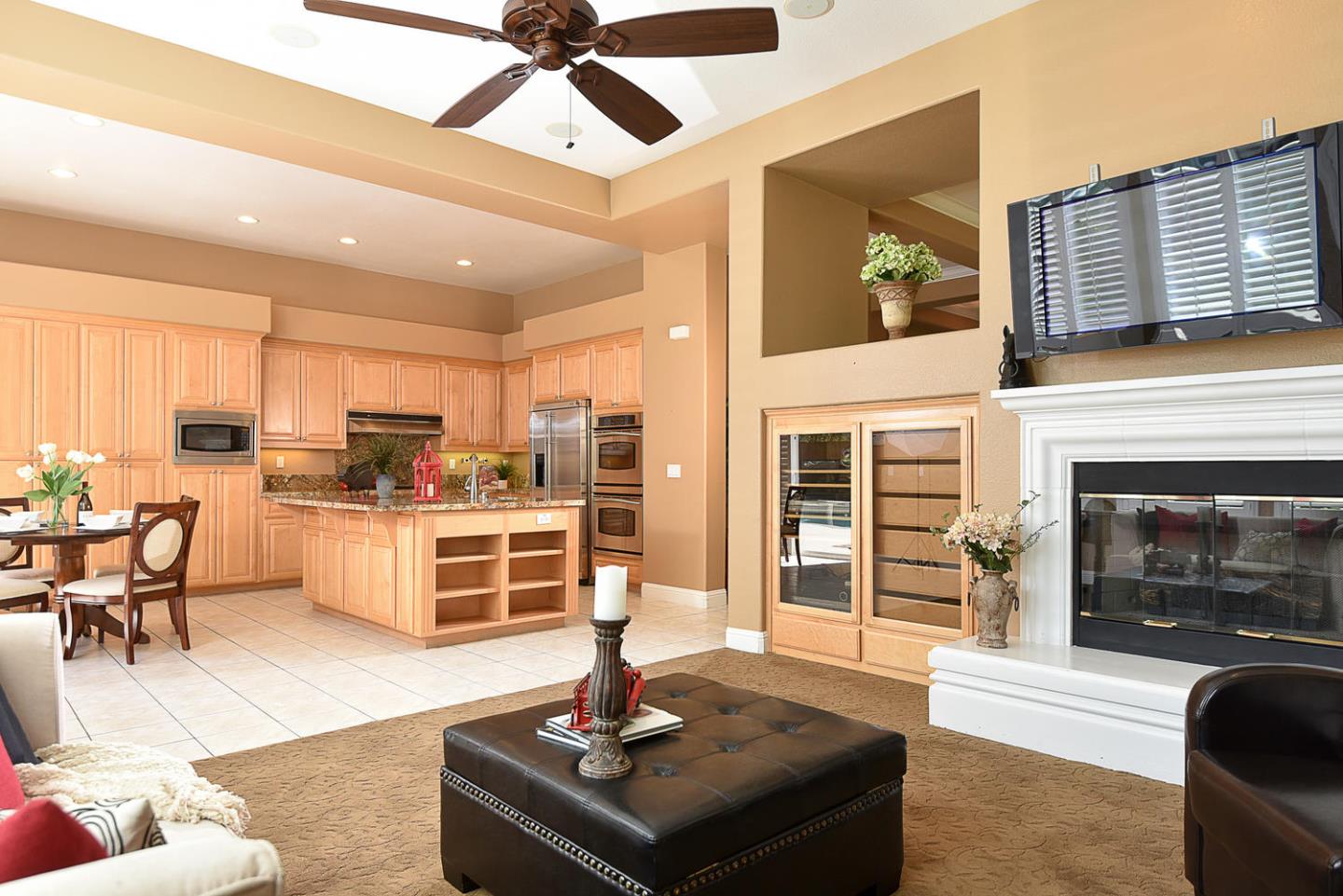 1492 Red Tail Place Morgan Hill, CA 95037 - Photo 14 of 25 a living room with stainless steel appliances furniture a rug and a view of kitchen