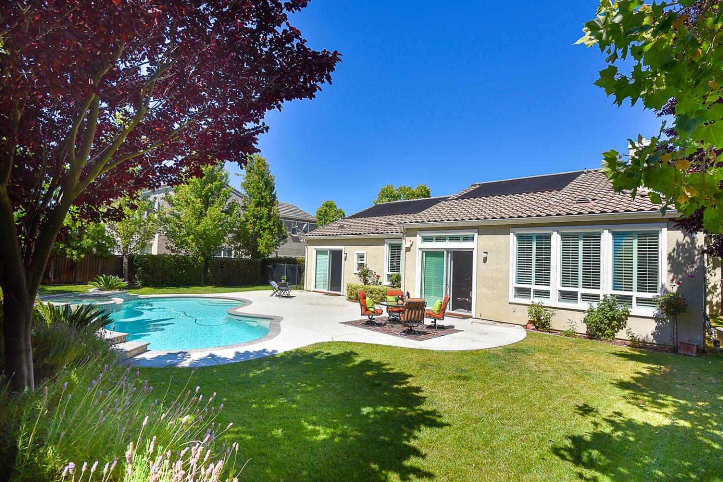 1492 Red Tail Place Morgan Hill, CA 95037 - Photo 23 of 25 a view of a patio with table and chairs potted plants and large tree