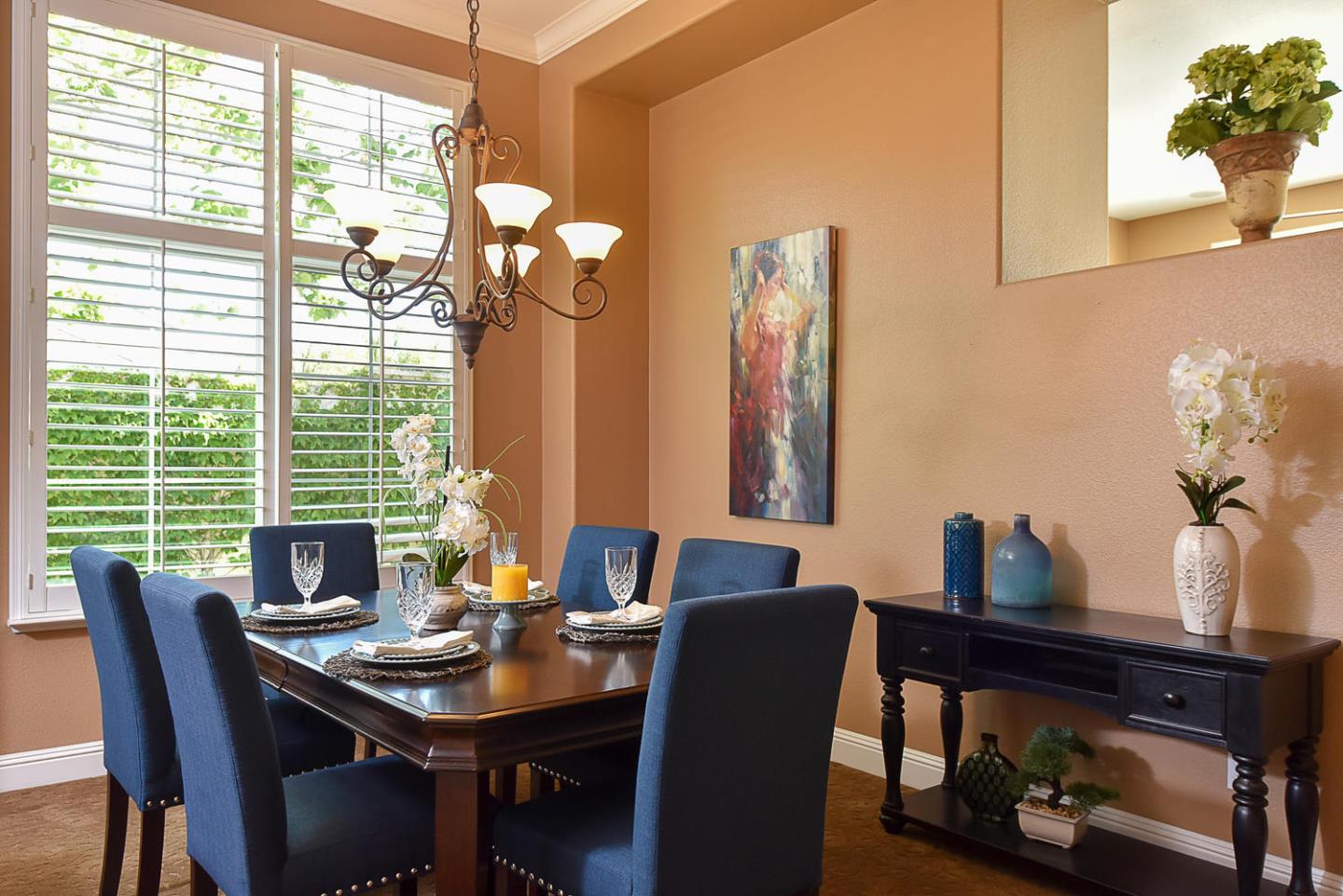 1492 Red Tail Place Morgan Hill, CA 95037 - Photo 8 of 25 a view of a dining room with furniture and chandelier