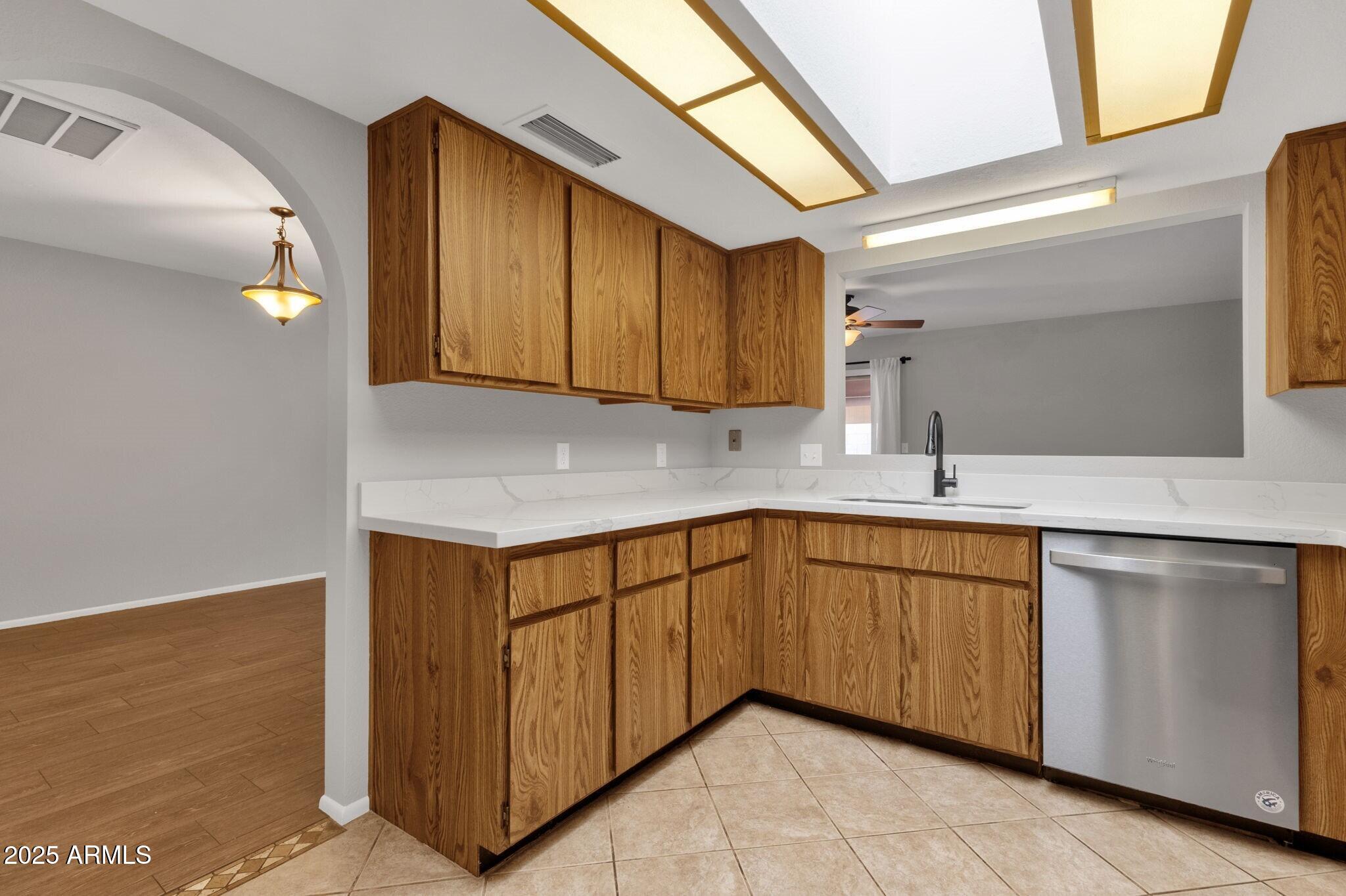 2530 East Wagoner Road Phoenix, AZ 85032 - Photo 14 of 35 a kitchen with stainless steel appliances granite countertop a sink and a cabinets