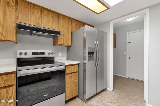 a kitchen with a refrigerator sink and stove