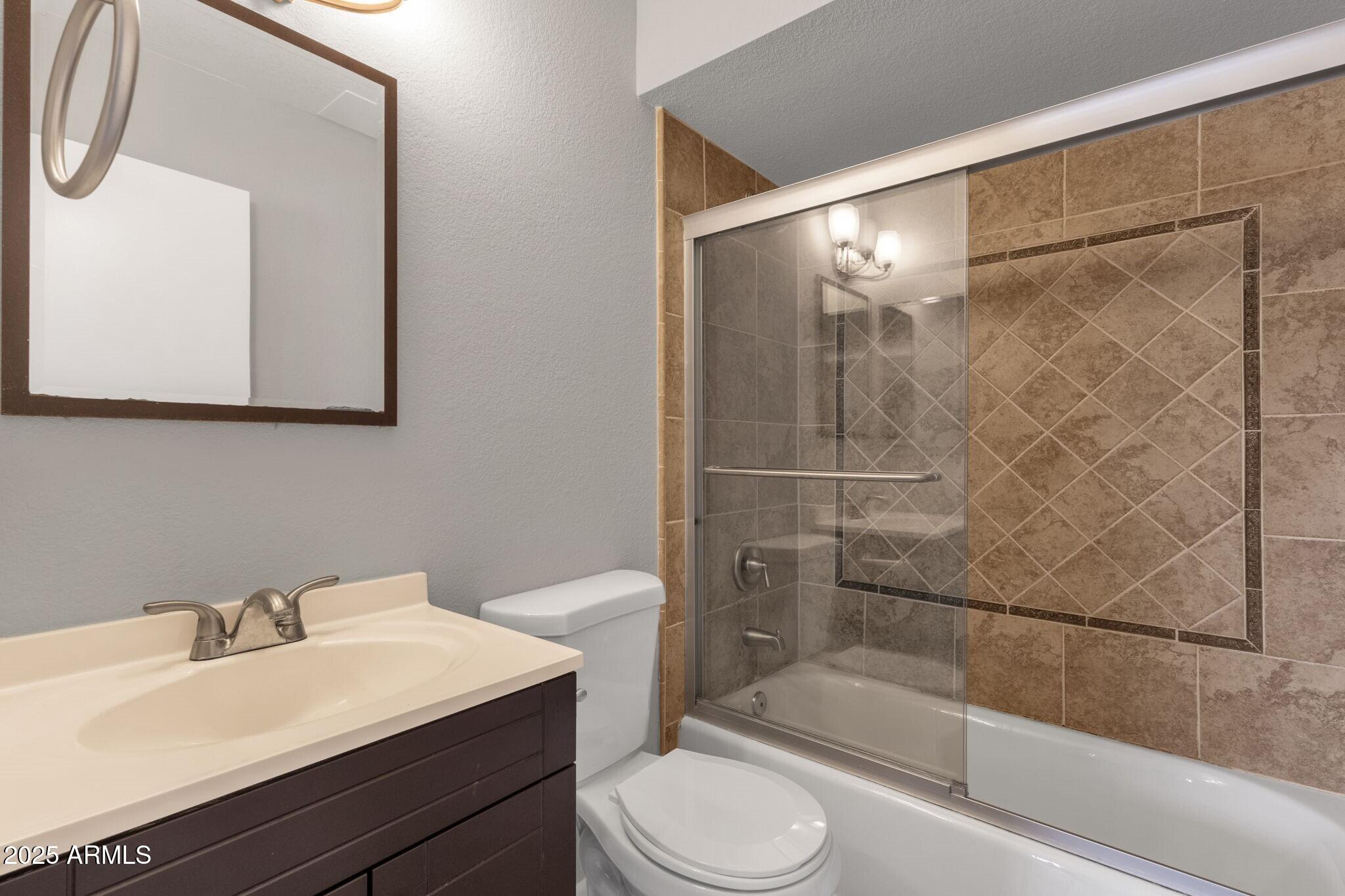 2530 East Wagoner Road Phoenix, AZ 85032 - Photo 21 of 35 a bathroom with a sink toilet and shower