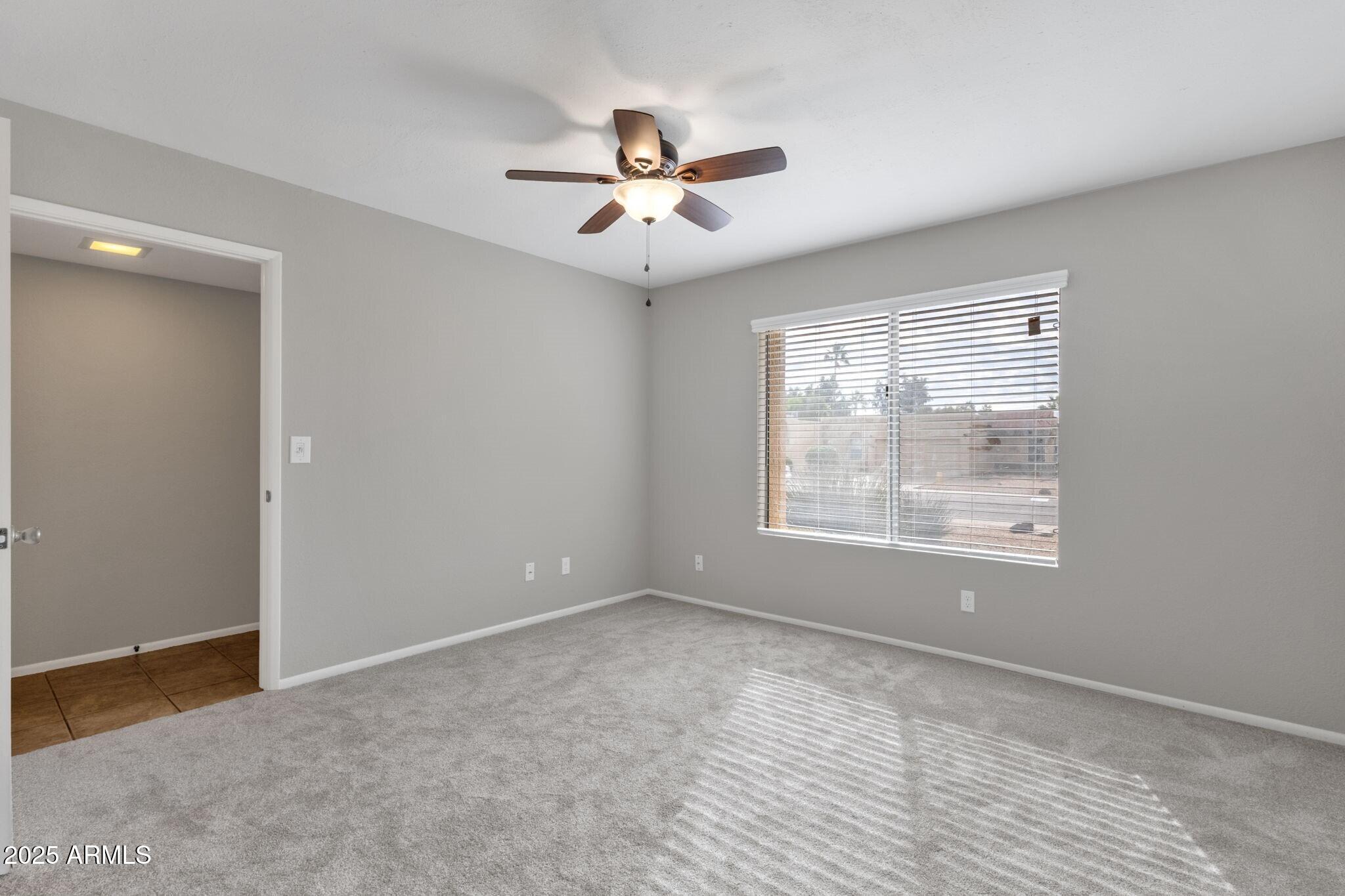 2530 East Wagoner Road Phoenix, AZ 85032 - Photo 24 of 35 a view of an empty room with a window