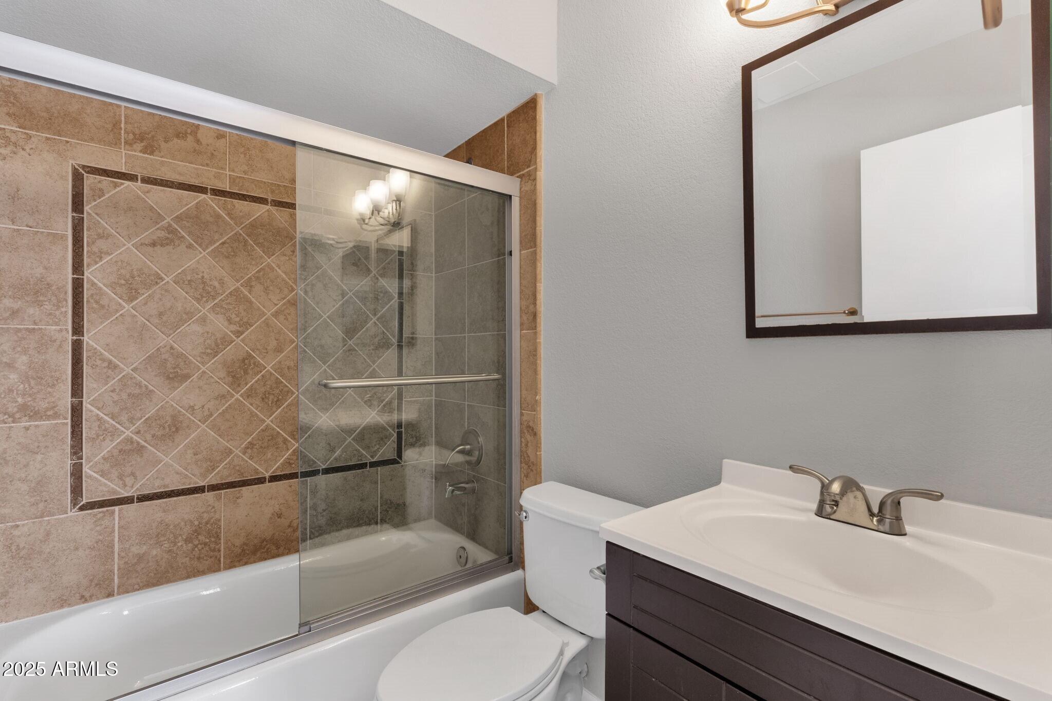 2530 East Wagoner Road Phoenix, AZ 85032 - Photo 26 of 35 a bathroom with a sink toilet and shower