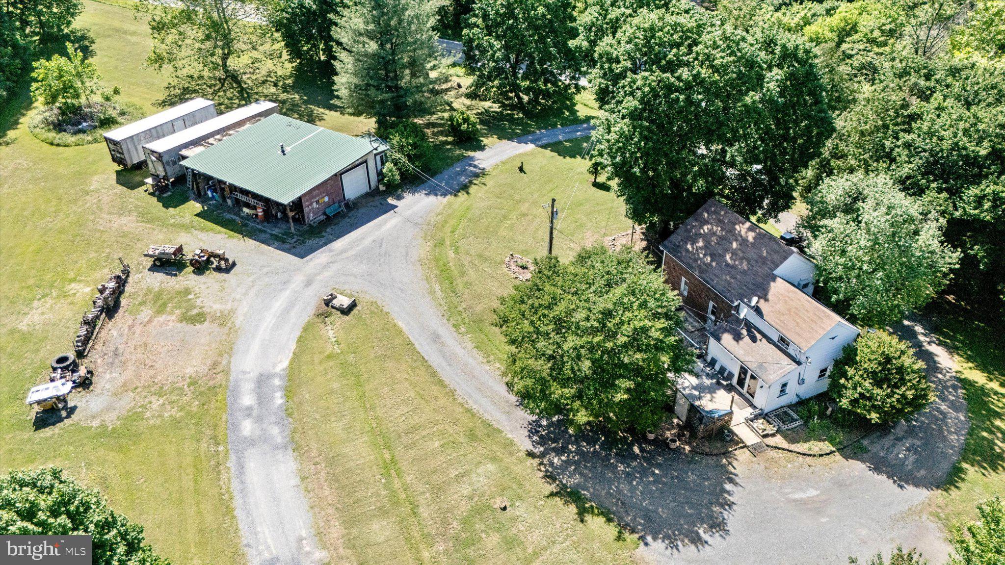 14721 Albert Staub Road Thurmont, MD 21788 - Photo 45 of 46 an aerial view of a house with swimming pool and large trees