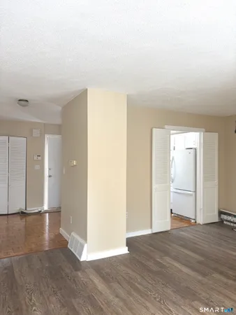 a view of a livingroom with wooden floor