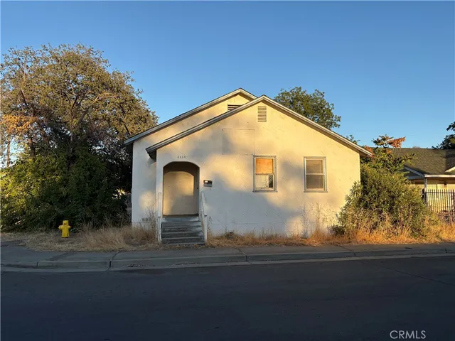 a front view of a house with yard