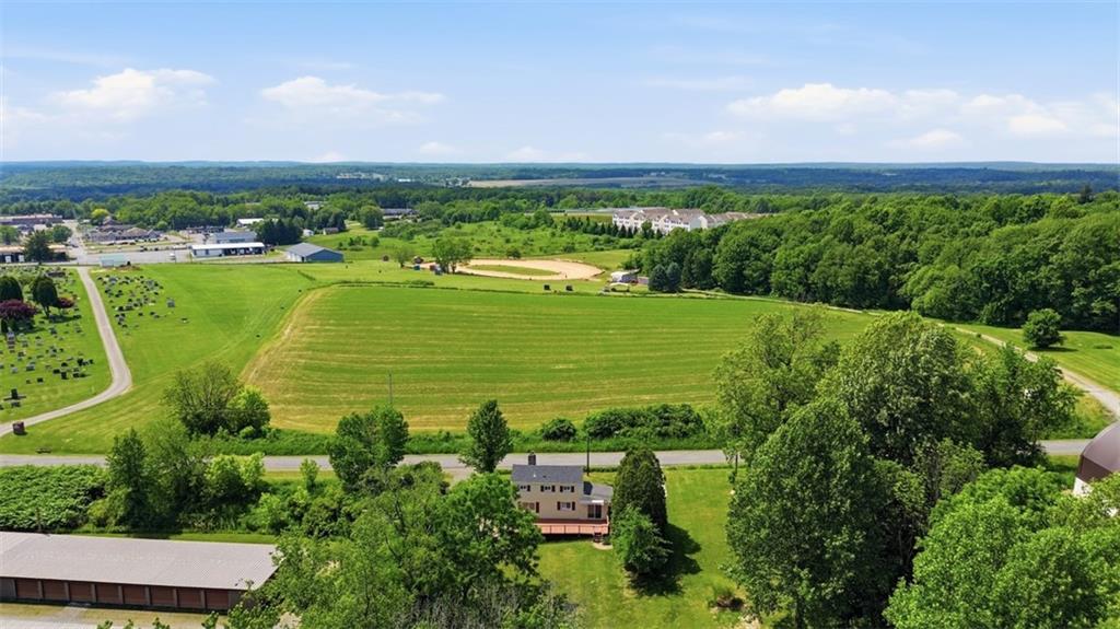 123 Cemetery Road Slippery Rock, PA 16057 - Photo 3 of 33 Enjoy breathtaking panoramic views from this beautifully situated property, offering a rare combination of privacy, open green space, and scenic countryside surroundings.