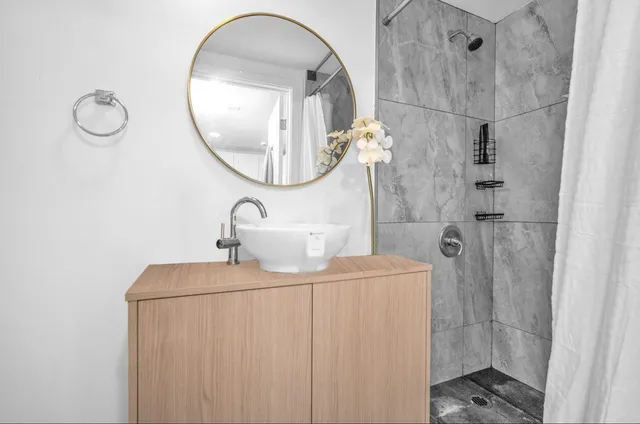 a bathroom with a sink and a mirror