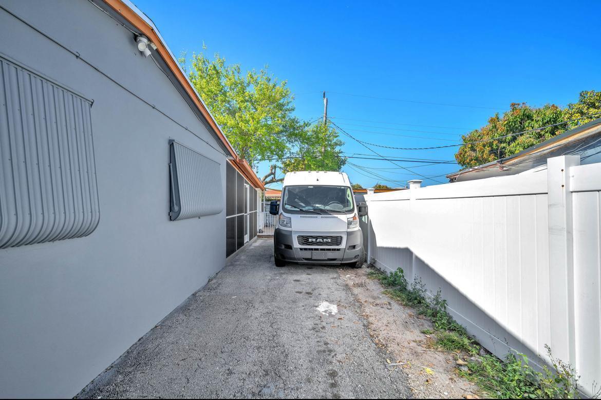7151 Taft Street, Unit REAR Hollywood, FL 33024 - Photo 8 of 8 a view of a house with a back yard